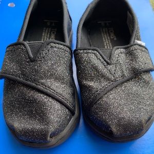 Toms black glitter slip ons